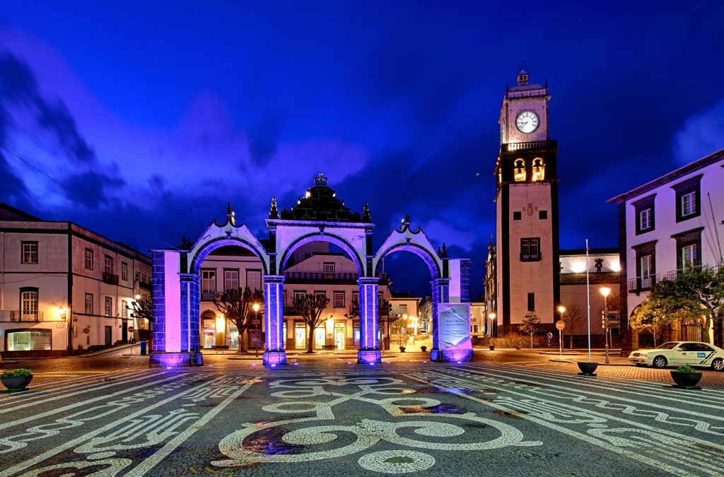 The Portas da Cidade (Gates to the City) Arch and Church of St Sebastian at night